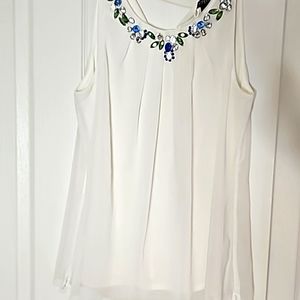 Whbm white top with jewels around the neck.